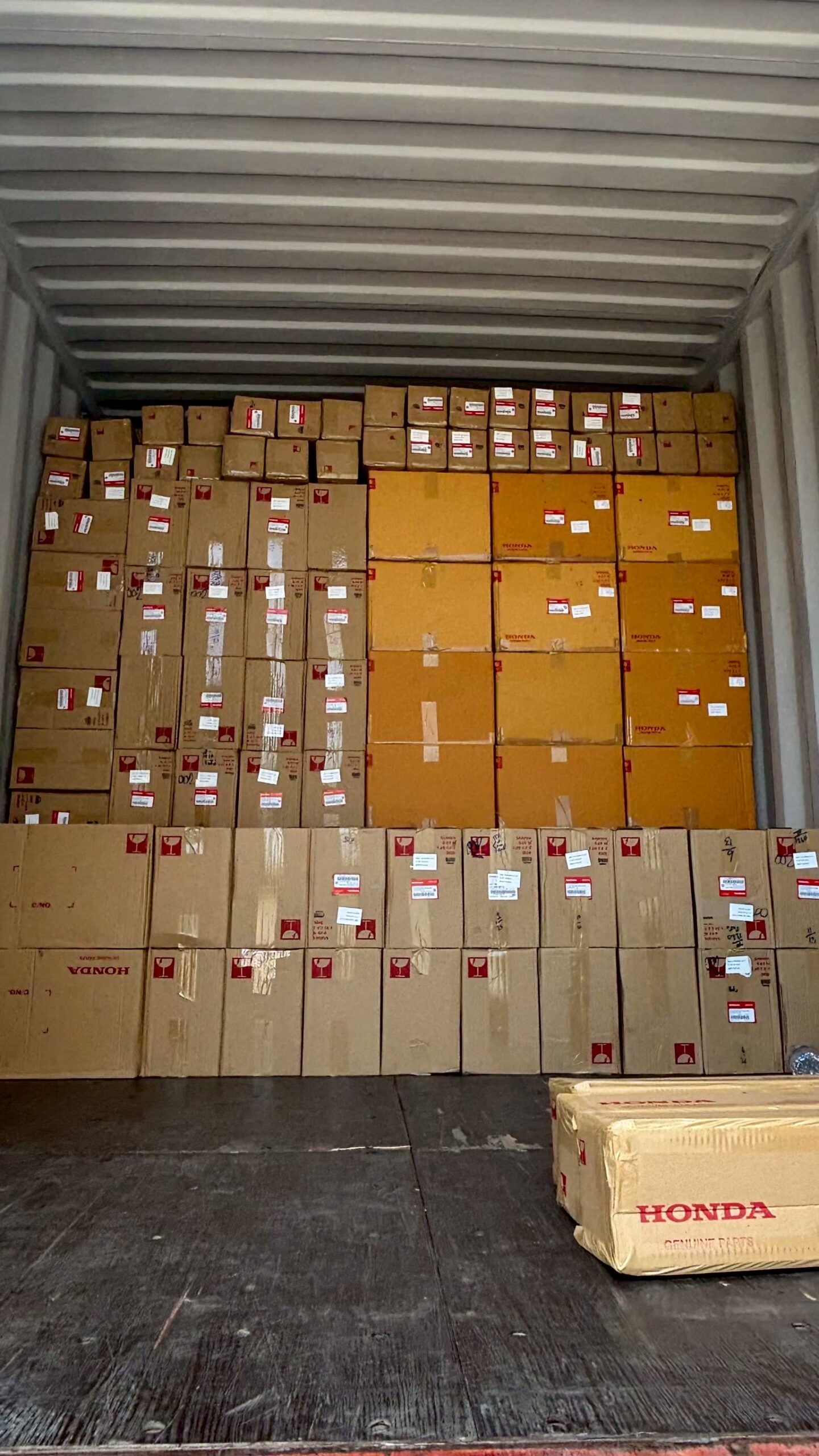 Honda motorcycle parts prepared inside an export container